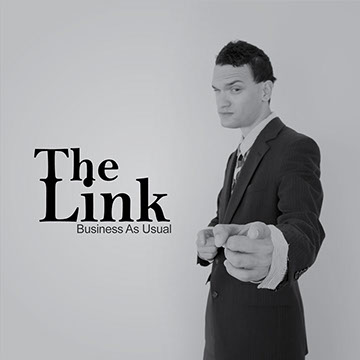 Linder David man in suit pointing at camera with logo on left side.